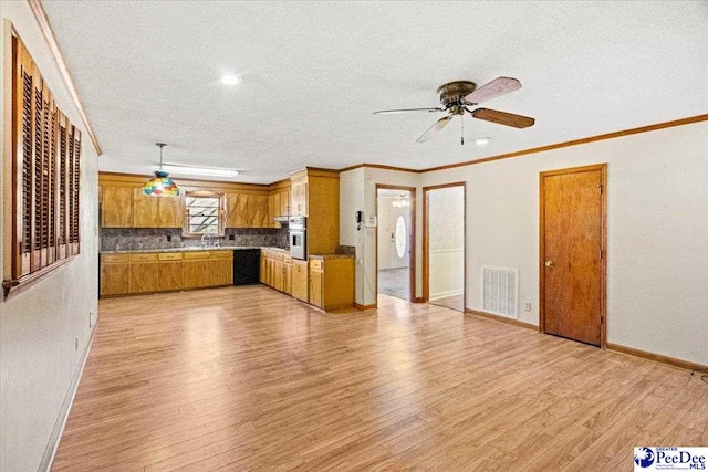 unfurnished living room with ceiling fan, ornamental molding, sink, and light wood-type flooring