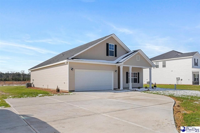 view of front of house featuring a garage and a porch