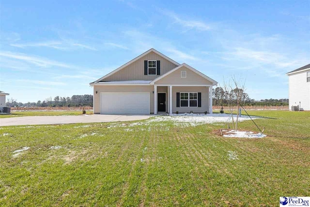 view of front of property with central AC, a garage, and a front lawn