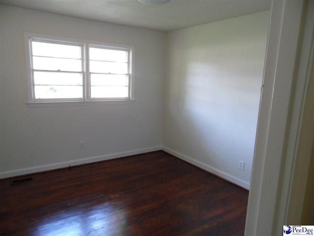 empty room featuring dark hardwood / wood-style floors