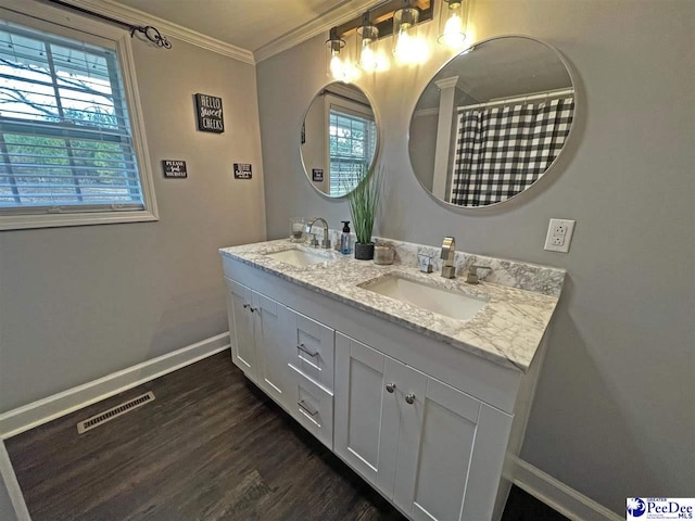 bathroom with vanity, hardwood / wood-style floors, crown molding, and a shower with shower curtain