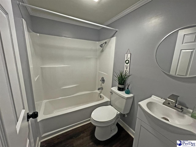 full bathroom with toilet, tub / shower combination, ornamental molding, vanity, and hardwood / wood-style floors