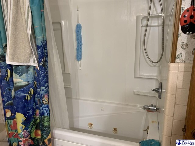 bathroom with shower / bathtub combination with curtain