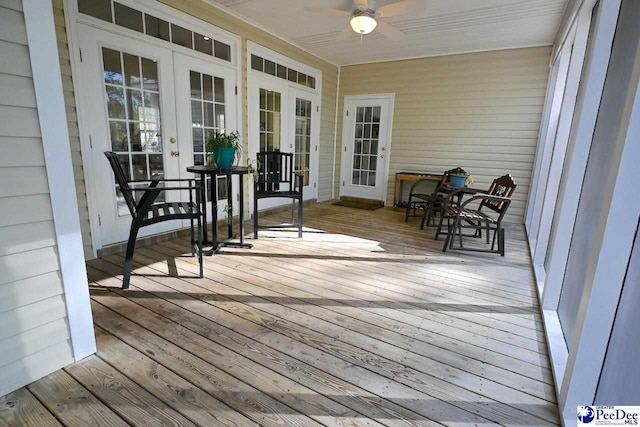 deck featuring french doors and ceiling fan