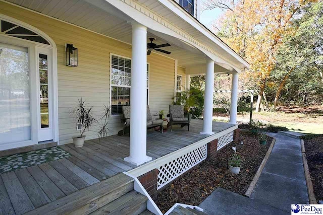 deck featuring ceiling fan and a porch