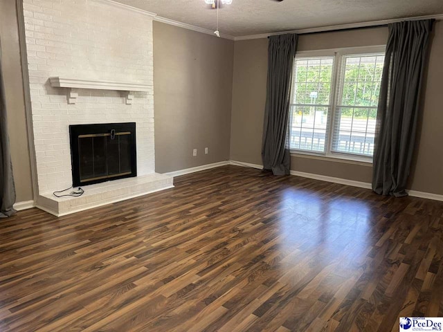 918 Fore Rd, Florence, SC 29506 - unfurnished living room with baseboards, ceiling fan, crown molding, dark wood-type flooring, and a fireplace