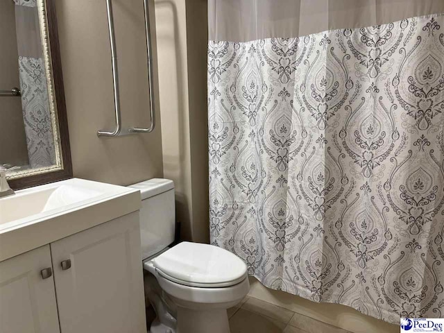 918 Fore Rd, Florence, SC 29506 - full bathroom featuring toilet, tile patterned floors, and vanity