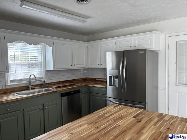 918 Fore Rd, Florence, SC 29506 - kitchen with wooden counters, a sink, fridge with ice dispenser, dishwasher, and tasteful backsplash