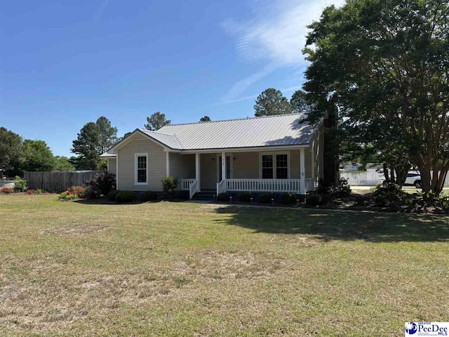 918 Fore Rd, Florence, SC 29506 - view of front of property with covered porch, fence, metal roof, and a front yard