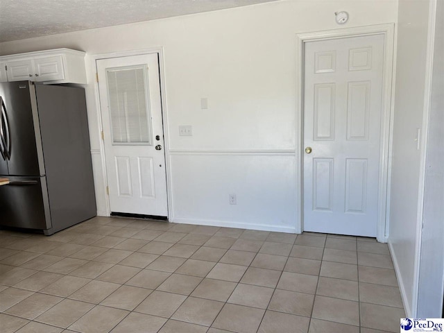 918 Fore Rd, Florence, SC 29506 - interior space featuring light tile patterned floors, baseboards, and a textured ceiling