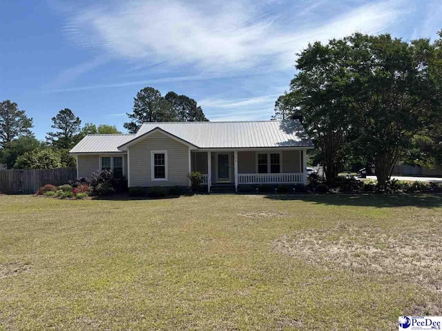 918 Fore Rd, Florence, SC 29506 - ranch-style home featuring a front yard, a porch, metal roof, and fence
