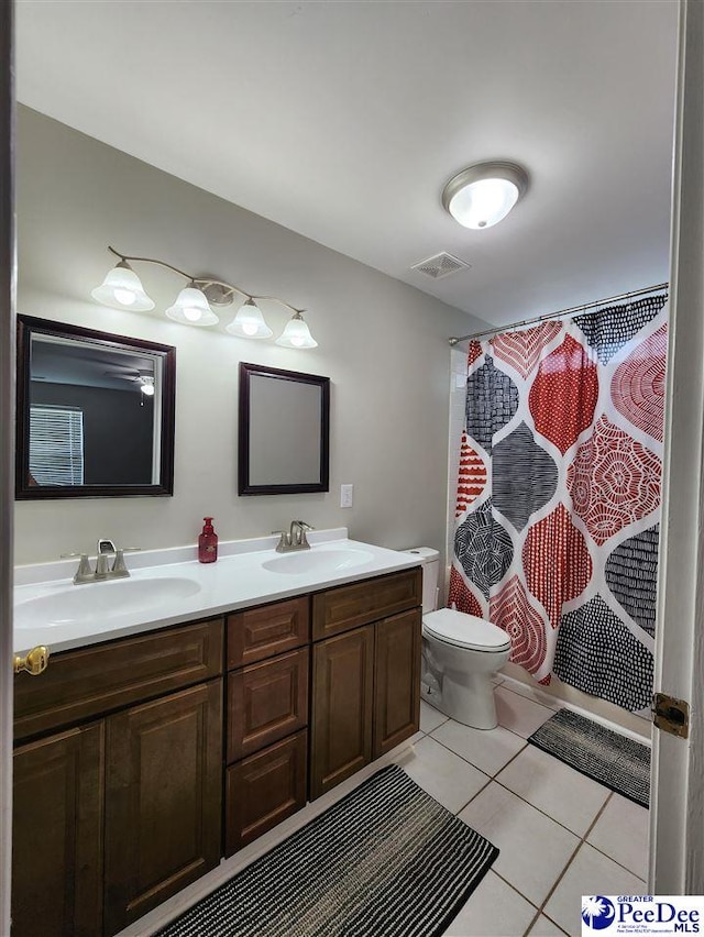 full bathroom featuring tile patterned floors, a sink, visible vents, and double vanity