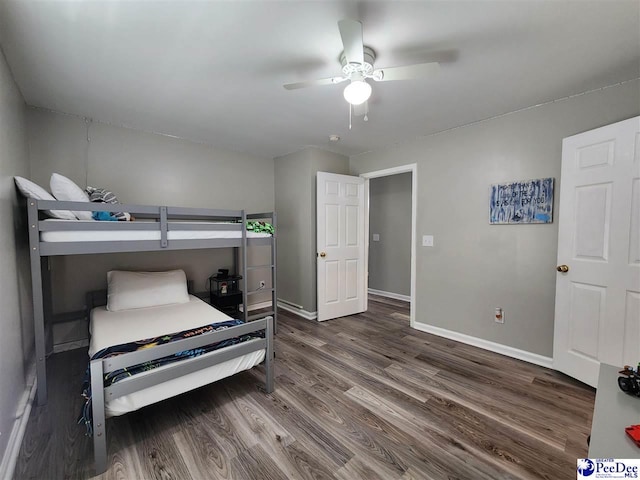 bedroom featuring baseboards, a ceiling fan, and wood finished floors