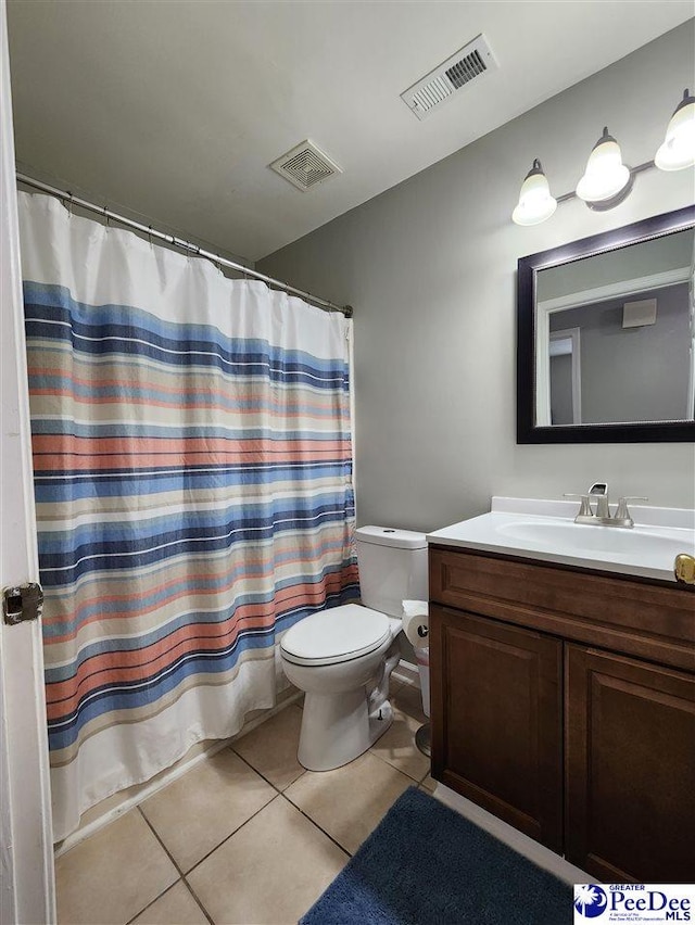 full bath featuring toilet, vanity, tile patterned floors, and visible vents