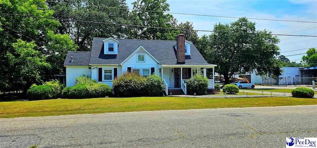 new england style home with a front yard