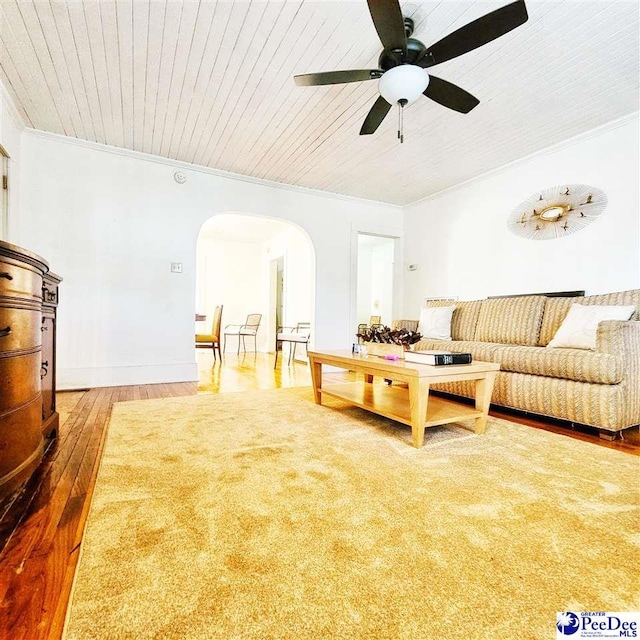 living room featuring hardwood / wood-style flooring, ornamental molding, wooden ceiling, and ceiling fan