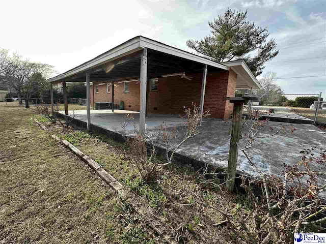 view of side of home featuring a patio