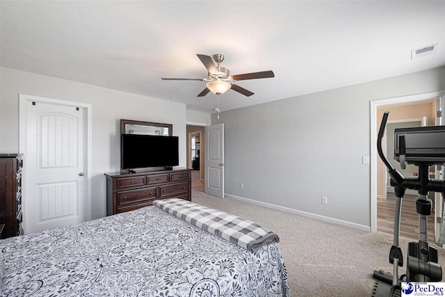 bedroom with baseboards, visible vents, ceiling fan, and carpet flooring