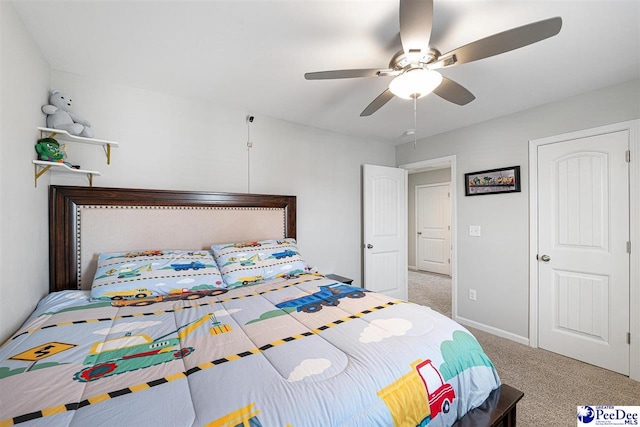 bedroom featuring baseboards, a ceiling fan, and carpet flooring