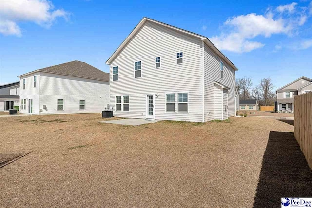 rear view of property with central AC and a patio