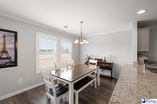 dining area featuring a notable chandelier, baseboards, ornamental molding, and dark wood-type flooring