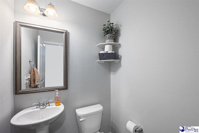 bathroom with a sink and toilet