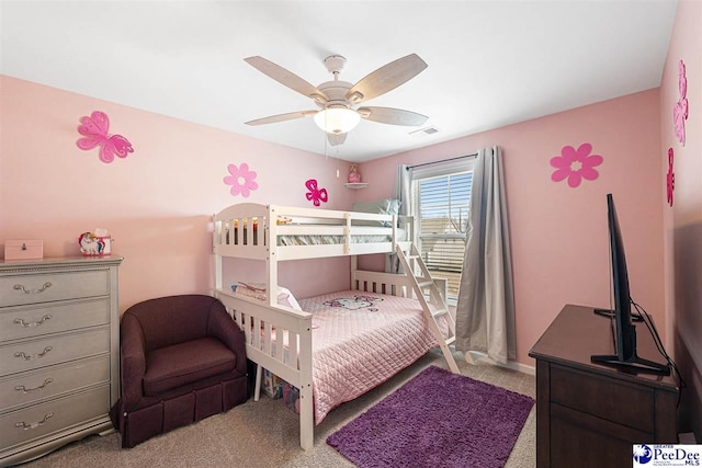 carpeted bedroom with ceiling fan and visible vents