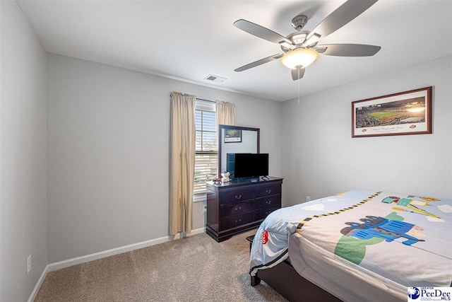 bedroom with carpet floors, visible vents, baseboards, and a ceiling fan