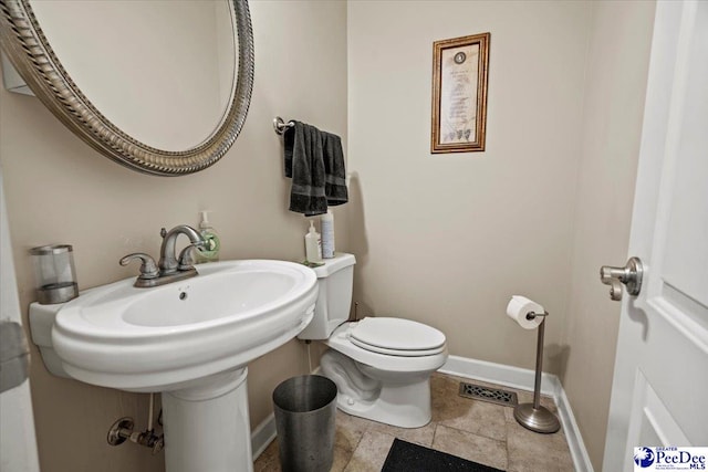 bathroom featuring toilet