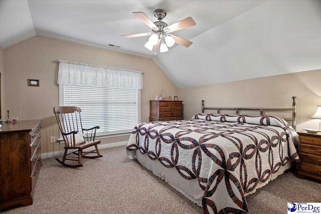 bedroom with ceiling fan, light colored carpet, and lofted ceiling