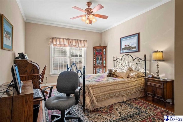 bedroom featuring ornamental molding, hardwood / wood-style floors, and ceiling fan