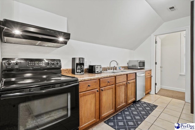 kitchen featuring sink, appliances with stainless steel finishes, light tile patterned flooring, vaulted ceiling, and exhaust hood