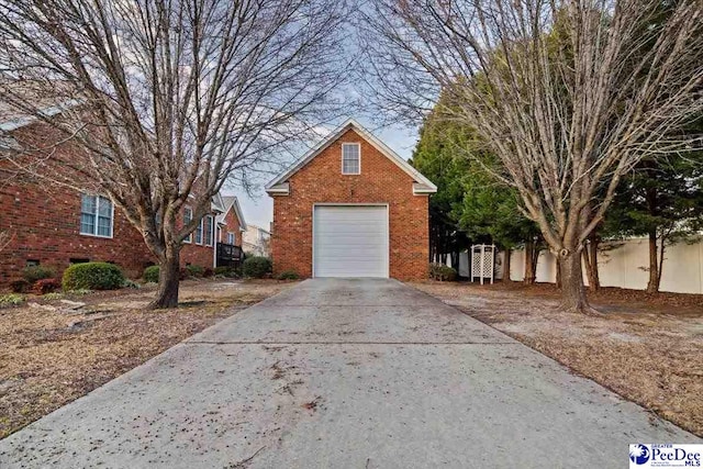 exterior space featuring a garage and an outdoor structure