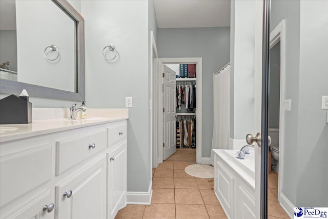 1850 Wax Myrtle Dr, Florence, SC 29501 - full bath with tile patterned flooring, vanity, toilet, and baseboards