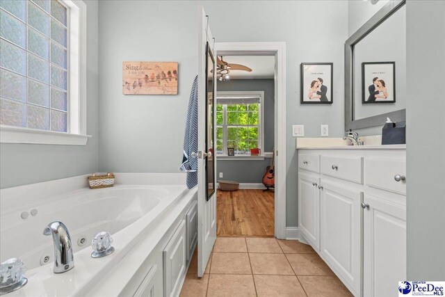 1850 Wax Myrtle Dr, Florence, SC 29501 - bathroom with tile patterned flooring, vanity, and a tub with jets
