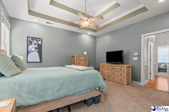1850 Wax Myrtle Dr, Florence, SC 29501 - carpeted bedroom with a tray ceiling, ornamental molding, ceiling fan, recessed lighting, and baseboards