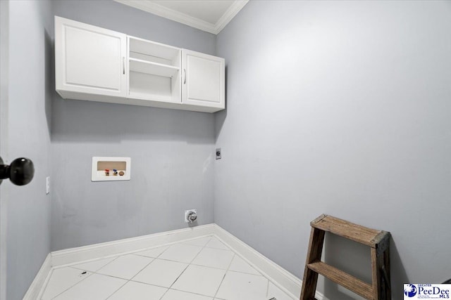 clothes washing area with cabinets, light tile patterned floors, hookup for a washing machine, crown molding, and electric dryer hookup