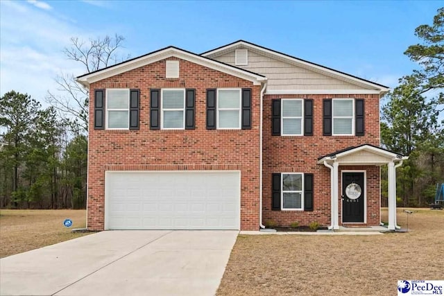 view of front of house featuring a garage, concrete driveway, and brick siding