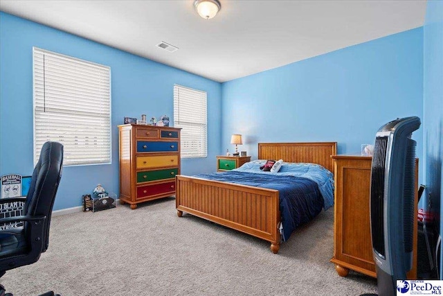 bedroom featuring carpet and visible vents