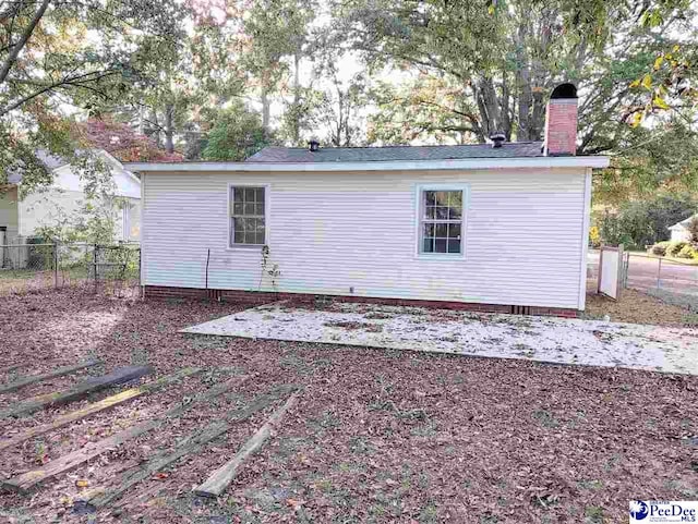 rear view of house with a patio