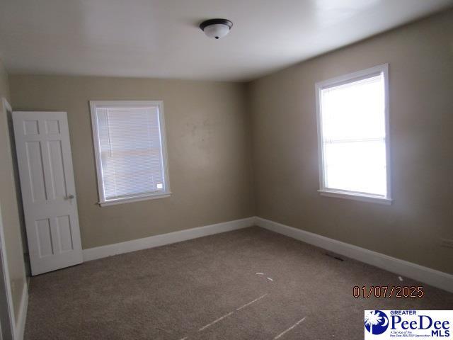 view of carpeted spare room