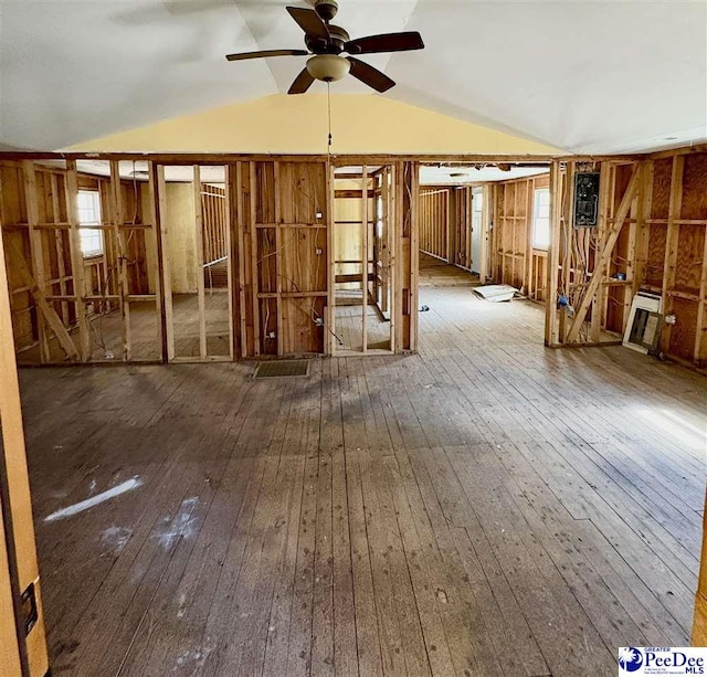 miscellaneous room with a ceiling fan, vaulted ceiling, and hardwood / wood-style flooring