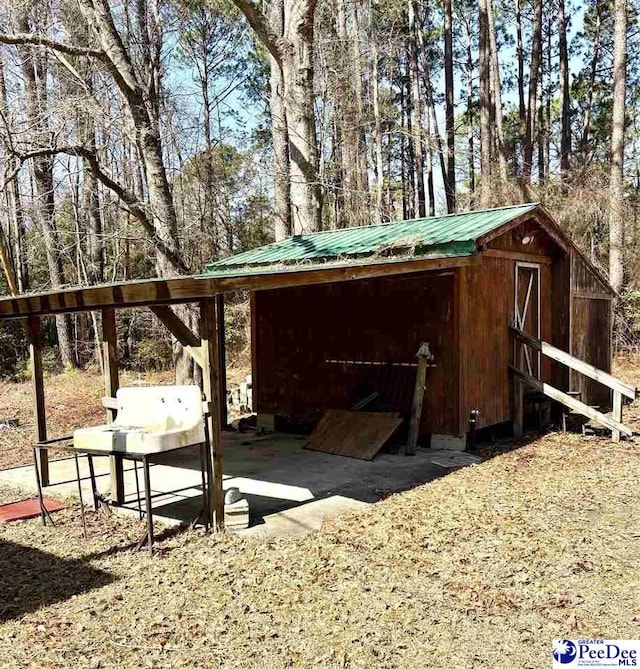 view of outbuilding featuring an outdoor structure