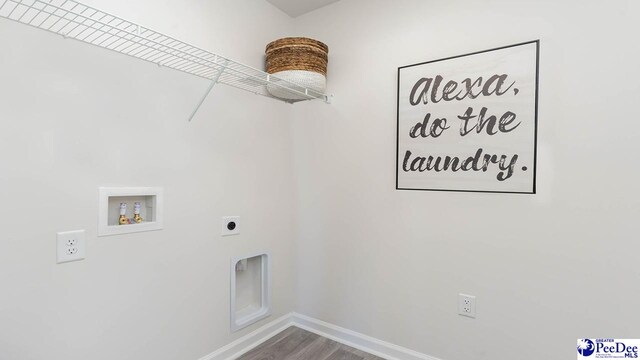 585 Strawberry Field Way, Galivants Ferry, SC 29544 - laundry room with hookup for a washing machine, hookup for an electric dryer, baseboards, and wood finished floors