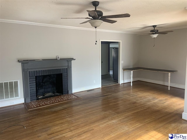 unfurnished living room featuring hardwood / wood-style floors, ceiling fan, crown molding, and a fireplace