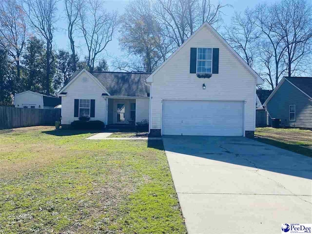 front facade with a garage and a front lawn