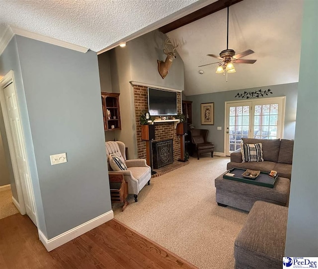 159 Ridge Rd, Cheraw, SC 29512 - living area featuring ceiling fan, a brick fireplace, lofted ceiling, wood finished floors, and a textured ceiling