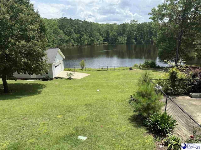 159 Ridge Rd, Cheraw, SC 29512 - view of yard with a water view, a garage, a forest view, and an outdoor structure