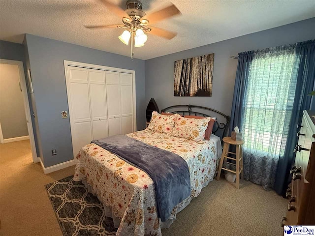 159 Ridge Rd, Cheraw, SC 29512 - carpeted bedroom featuring a closet, a textured ceiling, and a ceiling fan