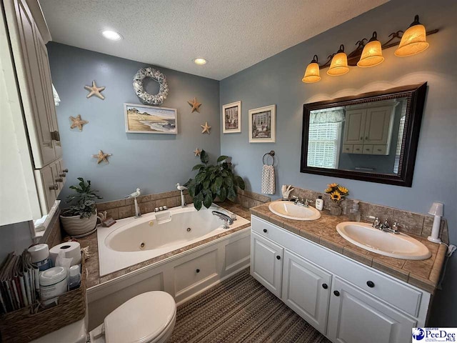 159 Ridge Rd, Cheraw, SC 29512 - full bathroom featuring a textured ceiling, a jetted tub, and double vanity